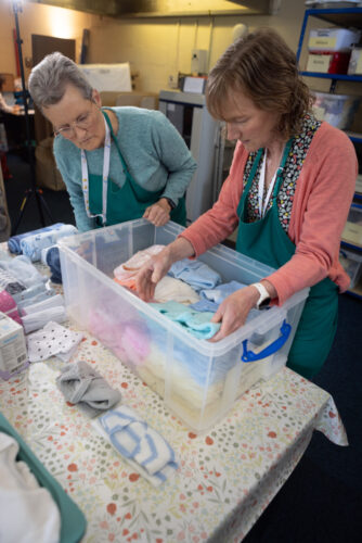A photo of volunteers packing a box