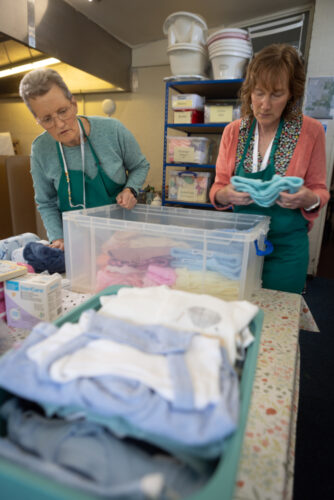 A image of a box being packed by volunteers